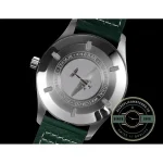 A steel pin buckle closes the brown calfskin strap of this green Mark XX clone