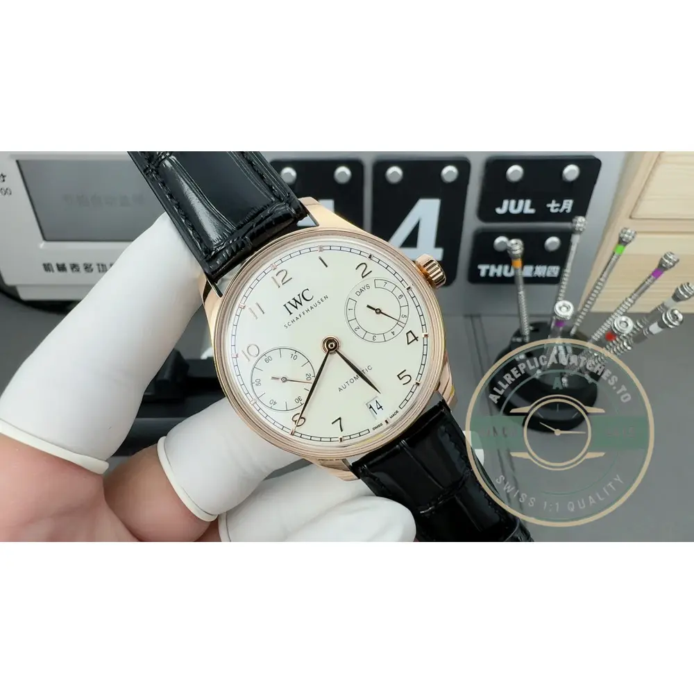 Applied gold indices lie on a silver-plated Portugieser dial