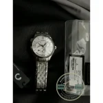 Bracelet and case from the side, 39mm across with a crown on each flank