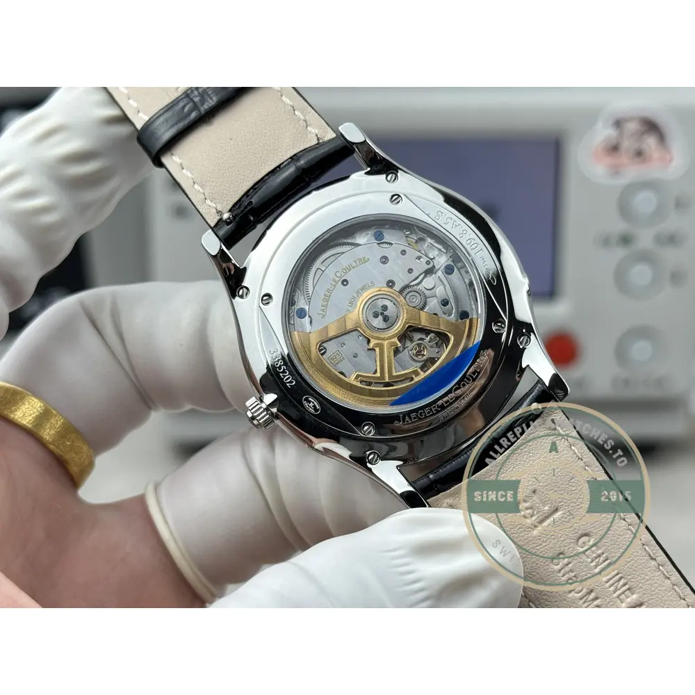 Moon phase aperture at six o'clock, the gold moon disc showing through on the black dial
