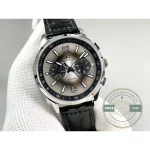 Fluted steel crown at 3 o'clock with a chronograph pusher above it and another below