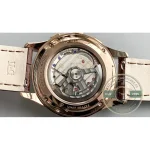 Faceted pink gold baton hands with lume fill, central chronograph seconds sweeping past 6