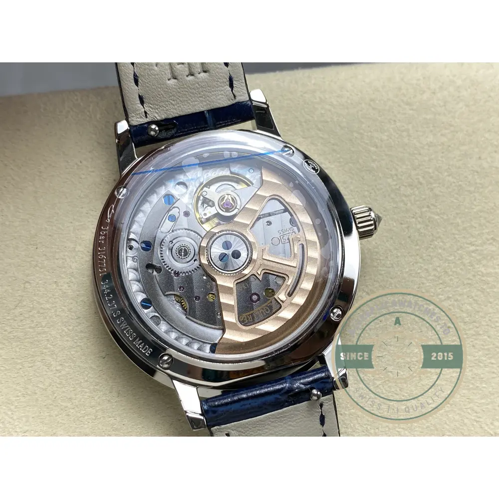 Sapphire caseback over the automatic movement, rotor and gold bridges in view