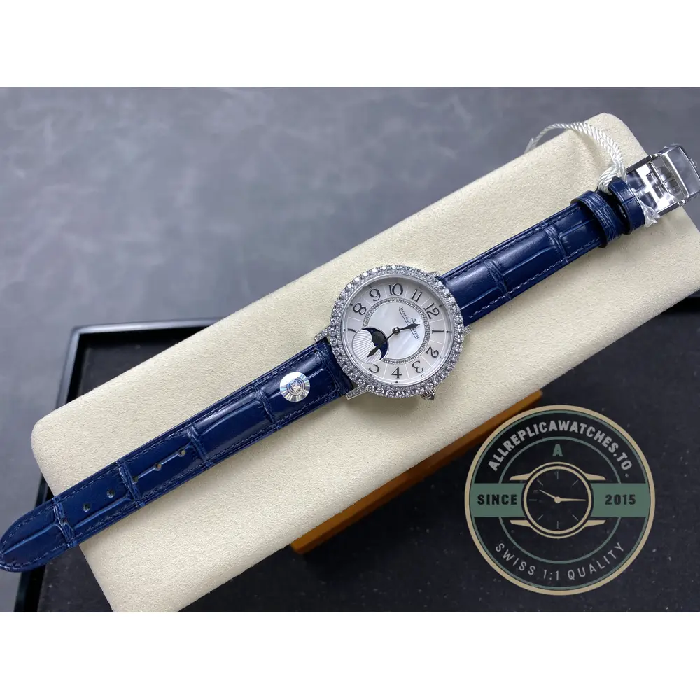 Whole watch from above on the cushion, strap laid straight below the case