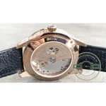 Black alligator strap with raised scales running out from the pink gold lugs