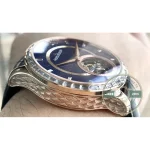 Graduated pink gold flange around the tourbillon opening, read by a dark pointer