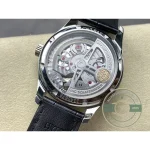 A domed and coated crystal sits above the rose-toned salmon dial surface