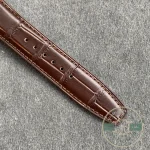 The crystal arcs over the calendar dial, treated to hold reflections down