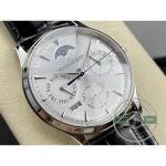 Blued hands and applied indices catching light across the silvered dial of the 1303520