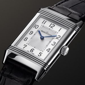 Jaeger-LeCoultre Reverso luxury watch closeup showing the iconic rectangular case and Art Deco design