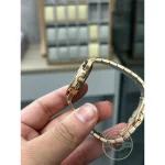 Date aperture at 6 o'clock framed in rose gold tone on the brown opaline Nautilus 7118/1200R-010
