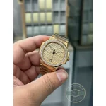 Rose gold tone Arabic 12 and applied batons on the golden brown 7118/1200R-010 dial