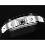 Crown flank in steel, blue cabochon seated between the two round pushers