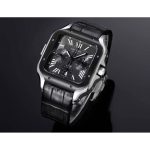 Black-dial chronograph standing upright, both counters catching the key light