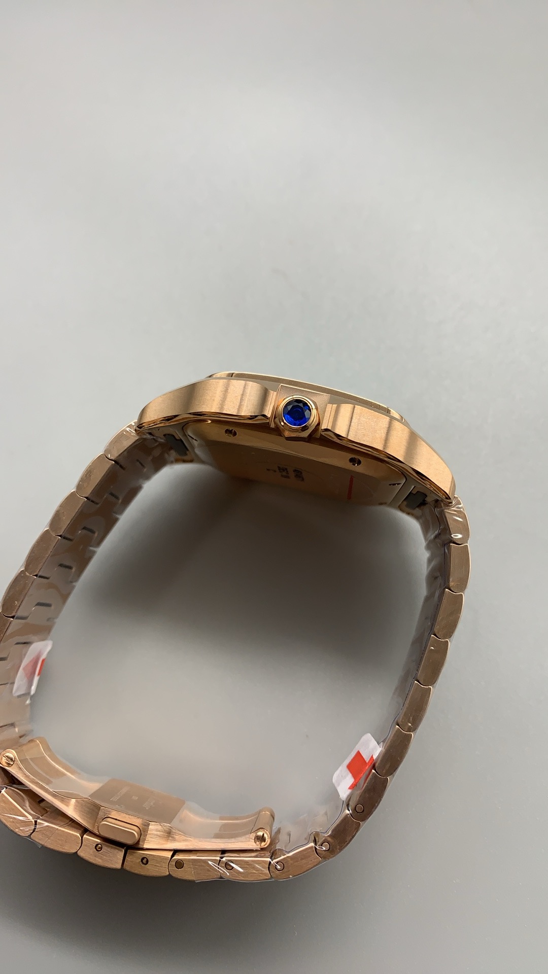 Bracelet loop open at the clasp with the blue cabochon crown in view