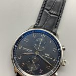 Silver subdials sit recessed into the black 41mm chronograph dial