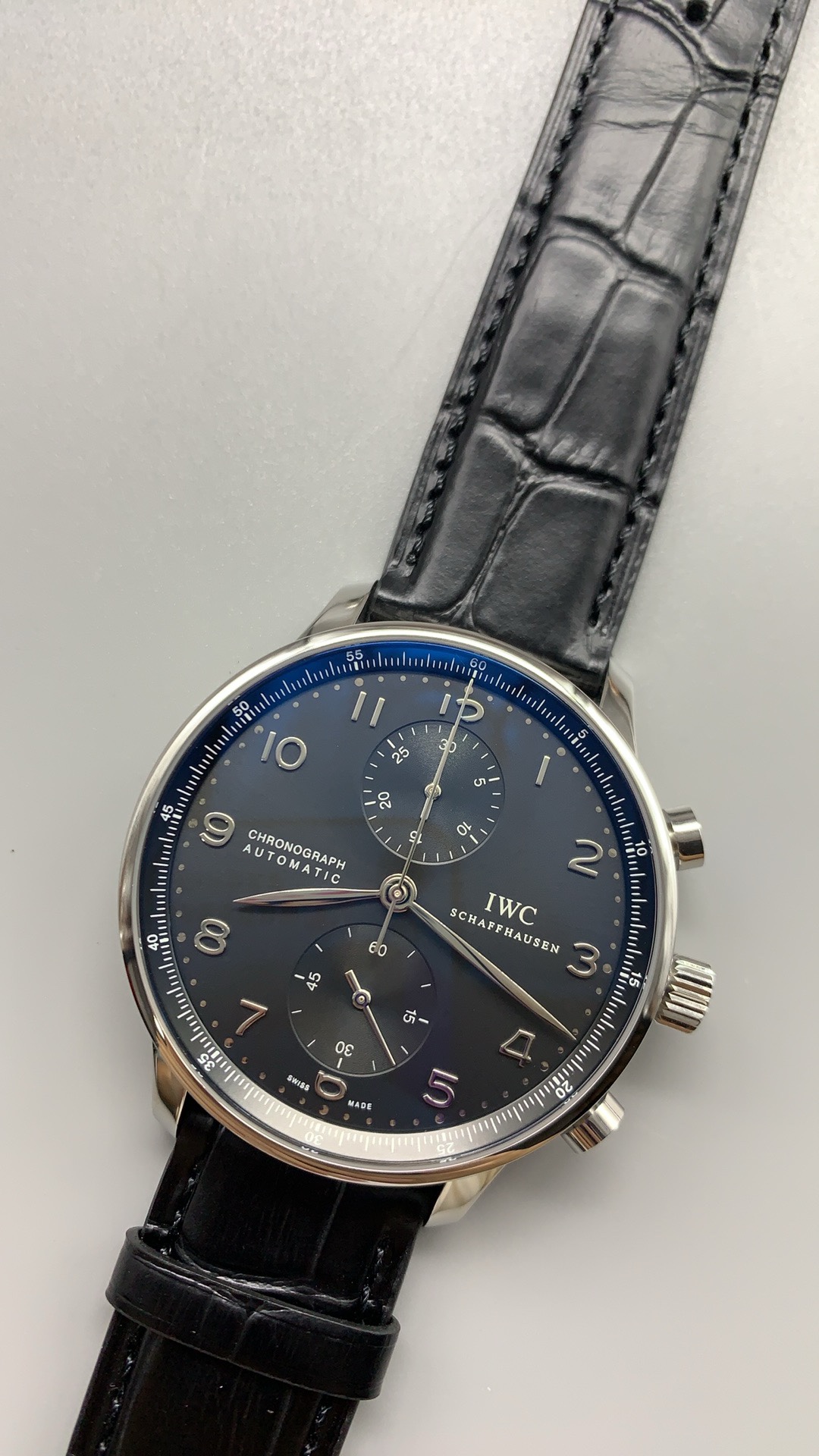 Silver subdials sit recessed into the black 41mm chronograph dial
