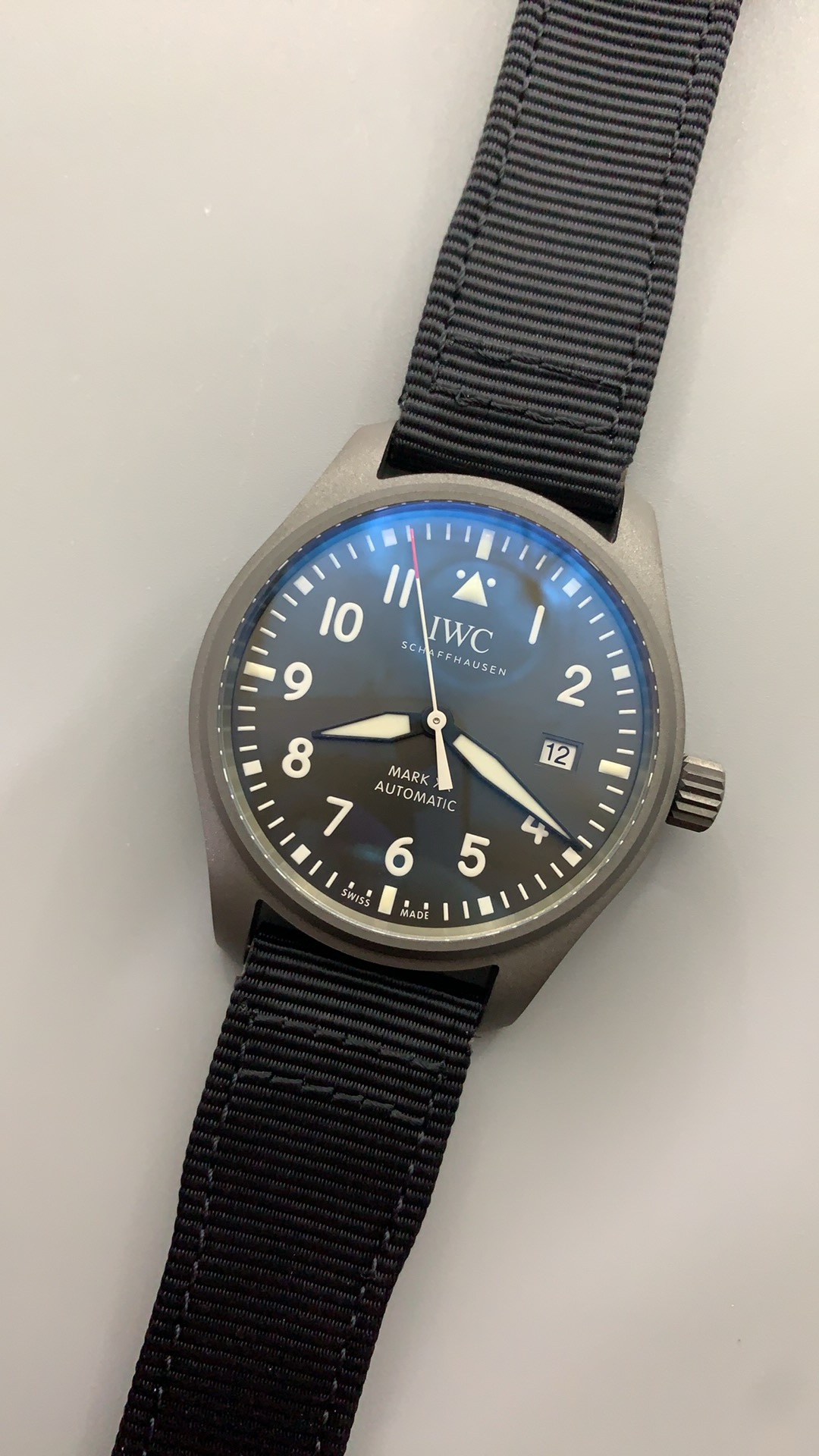Brushed grey dial of the Patrouille Suisse replica under coated sapphire