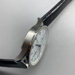 Silver brushing across the subdials, visible under magnification