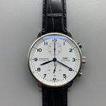 Coated sapphire curves above the white lacquer of this chronograph dial
