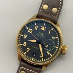 The conical crown is cut from the same alloy, so it patinas with the case
