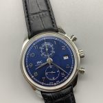 Under a modern blue dial the railroad minute track stays intact