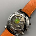 Silver subdials with circular graining set into the steel blue dial
