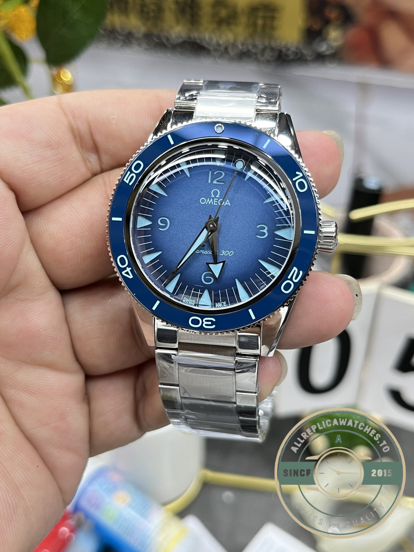 Blue dial of the super clone Omega Seamaster 300, colour holding steady across the whole face