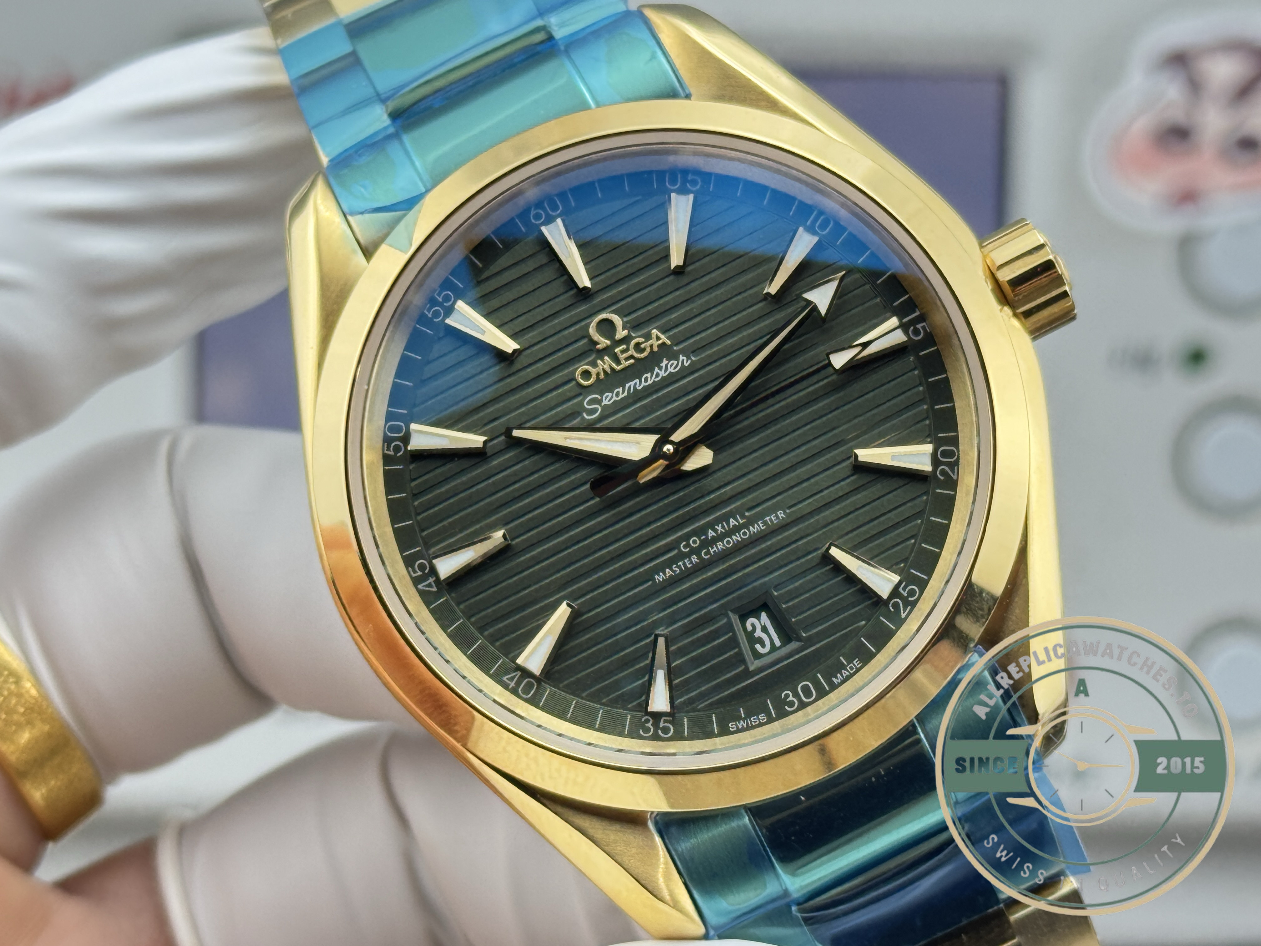 Automatic winding through the rotor of the VS8900 in this gold Omega Aqua Terra superclone
