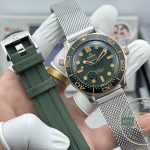 Black ceramic bezel framing the sunburst green dial of this titanium Seamaster clone