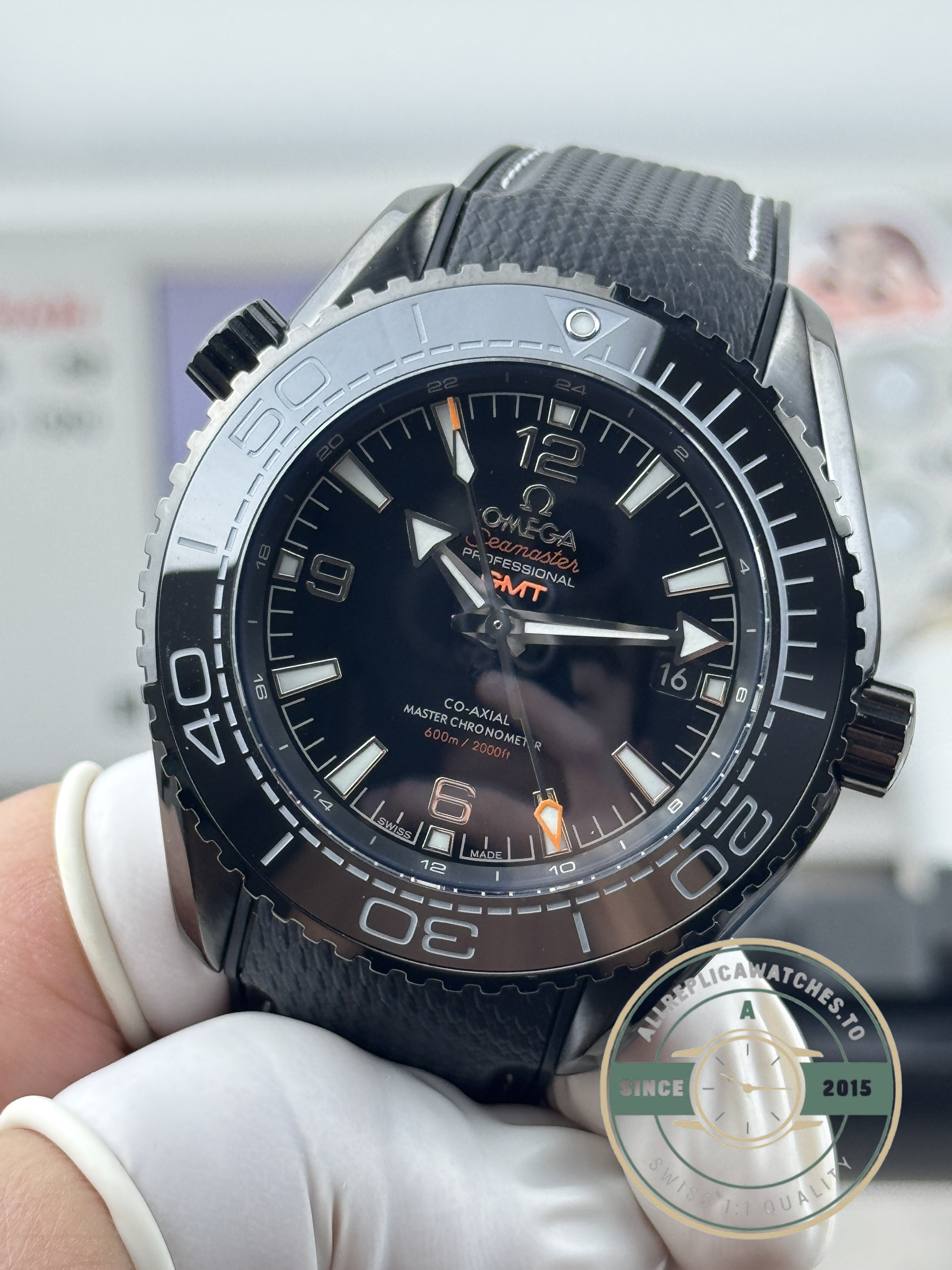 GMT hand driven by the VS8900 automatic, 48-hour reserve, superclone Omega Planet Ocean Deep Black