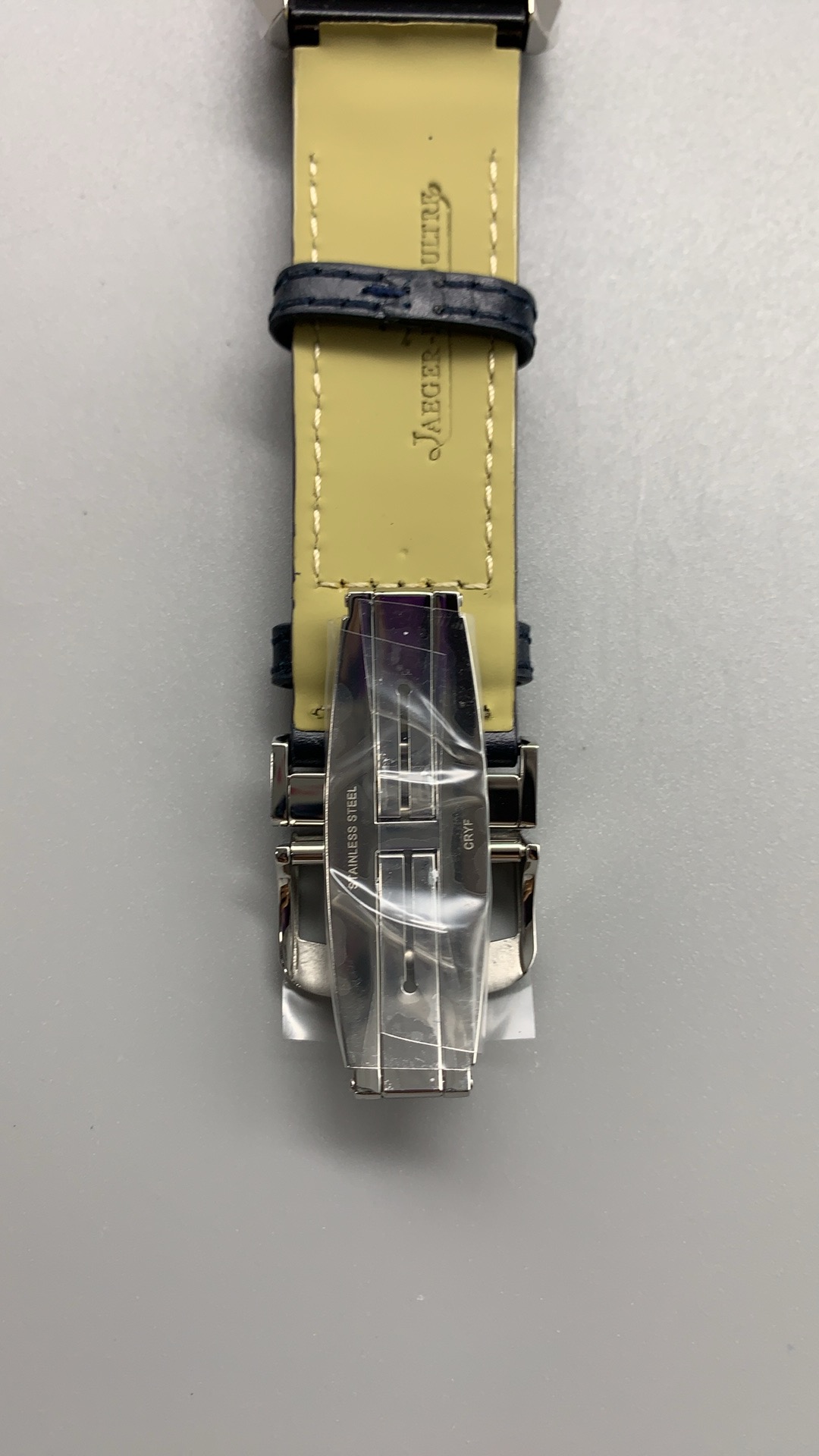 Wrist shot showing the 45.6 x 27.4 mm rectangular case footprint with the strap fastened