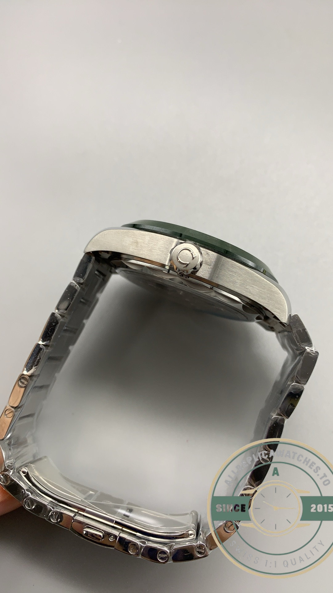 Replica Omega Aqua Terra Worldtimer 43mm case shown in profile against the world time dial
