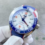 White applied-index dial of the clone Planet Ocean 6000M, luminous bars reading clean against steel