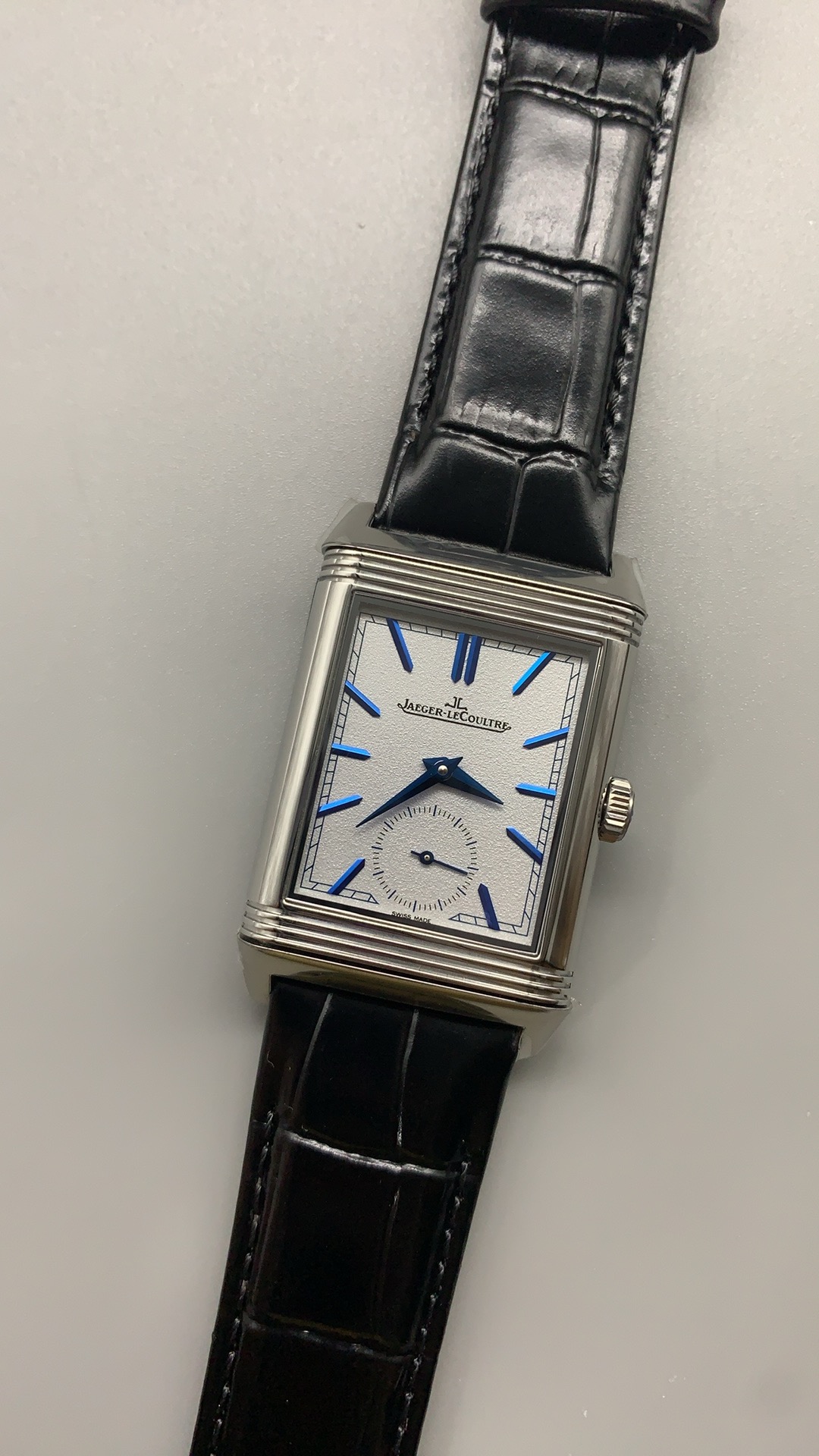 Angled three-quarter view of the JLC Reverso Tribute Duoface super clone in stainless steel