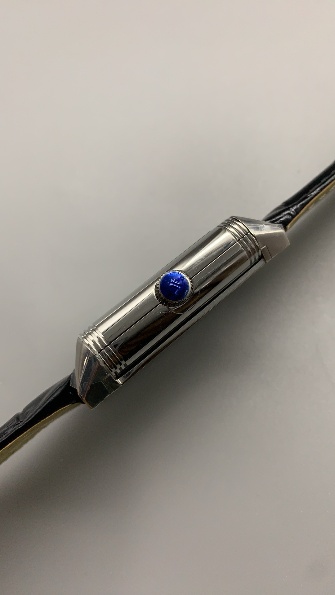 Sapphire crystal of the JLC Reverso Tribute Duoface replica viewed at an angle under light