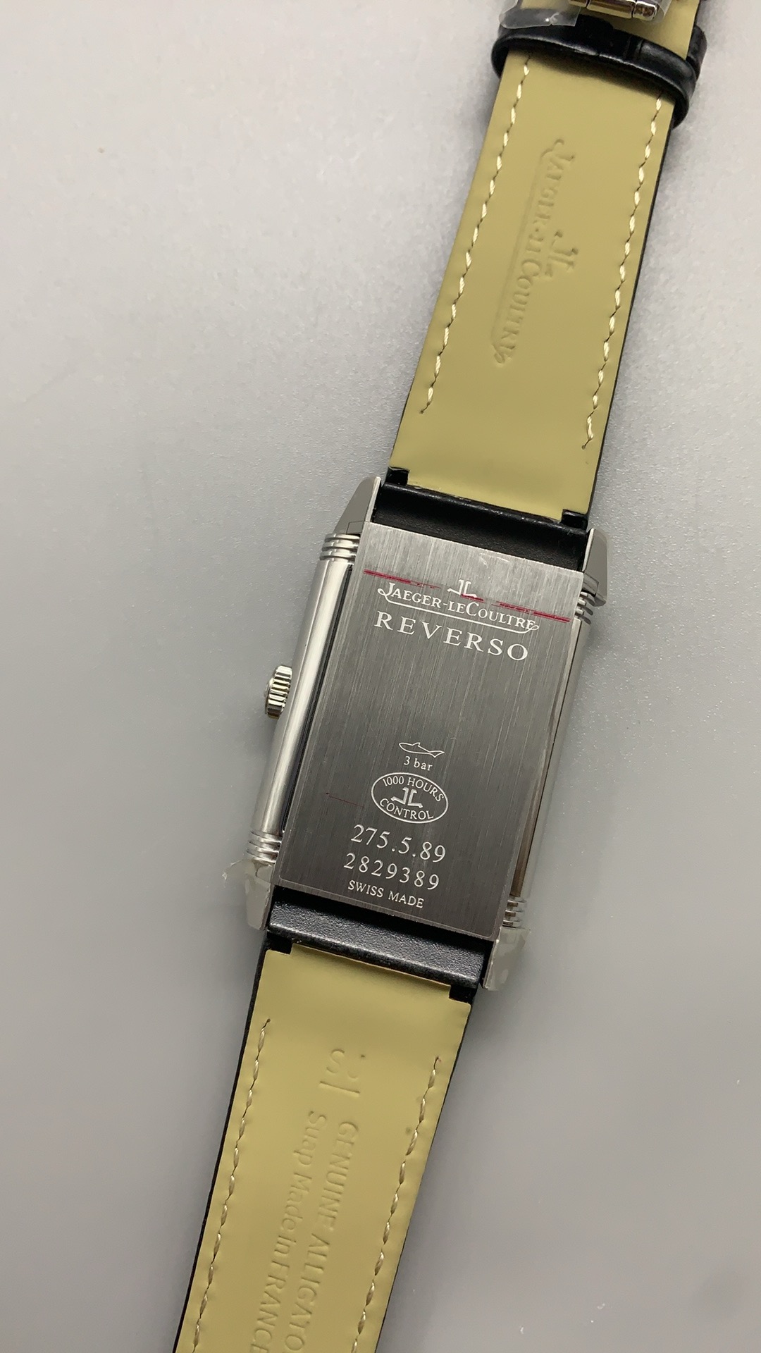 Cradle rails and pivot of the steel JLC Reverso replica case, flip mechanism in the locked position