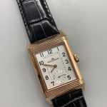 Wrist shot of the rose gold JLC Reverso replica worn with the guilloché dial facing out