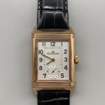Guilloché texture of the silver dial raking the light at an angle on this Reverso super clone