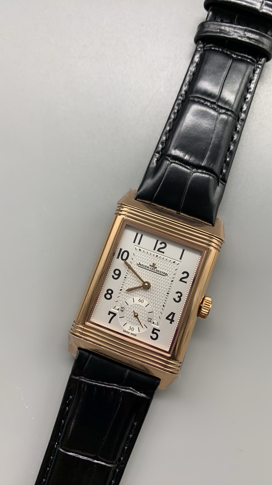 Outer numeral ring of the Reverso Duoface replica, black Arabic figures on silver guilloché
