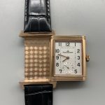 Three-quarter angle showing the rose gold case rails and the recessed dial opening