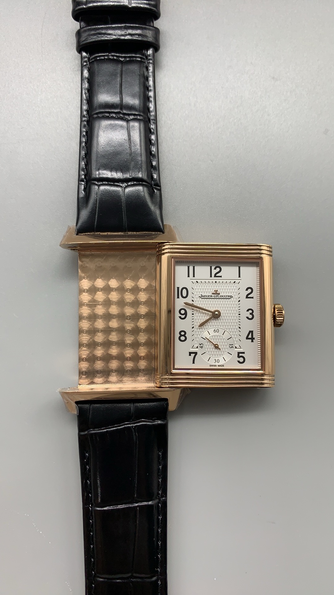 Three-quarter angle showing the rose gold case rails and the recessed dial opening