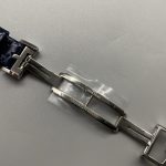 Strap and lug junction of this JLC Reverso replica, blue alligator leather meeting steel