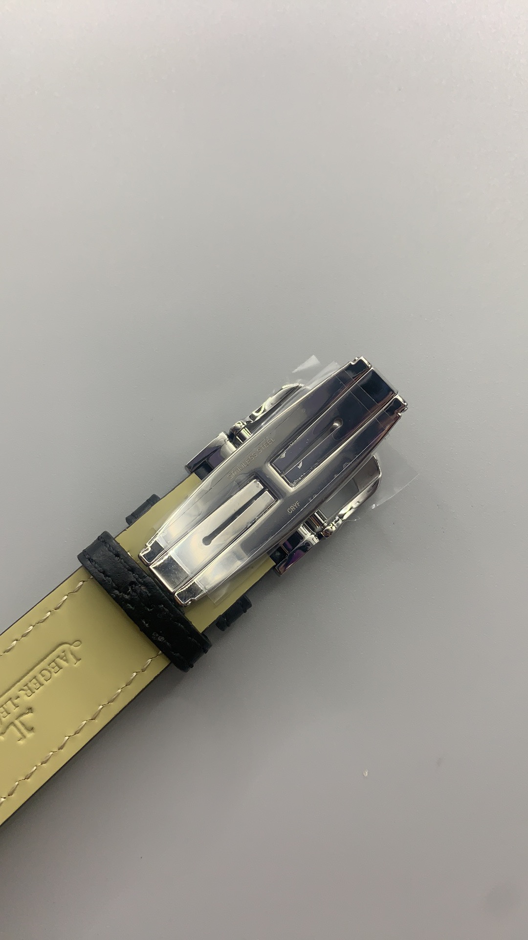 Rectangular 45.6 x 27.4 mm steel Reverso worn on the wrist, dial facing upward