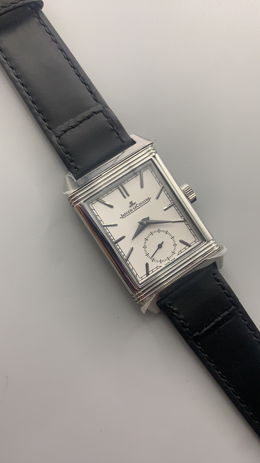 Side profile of the slim steel Reverso case where it meets the smooth leather strap