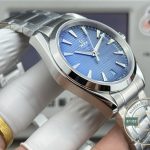 Each teak groove casting its own micro-shadow, superclone Omega Aqua Terra dark navy dial