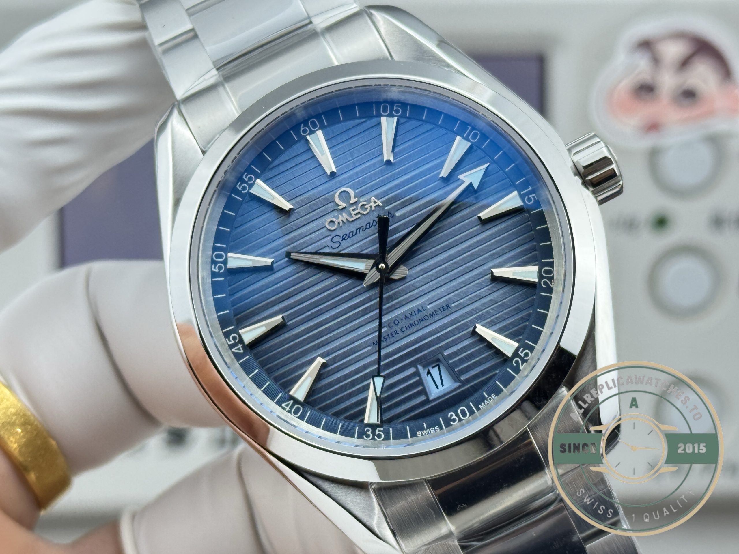 Exhibition caseback showing rotor and bridges, replica Omega Aqua Terra in dark navy