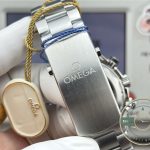 Matte-finished titanium links catching low light, superclone Omega Seamaster Planet Ocean