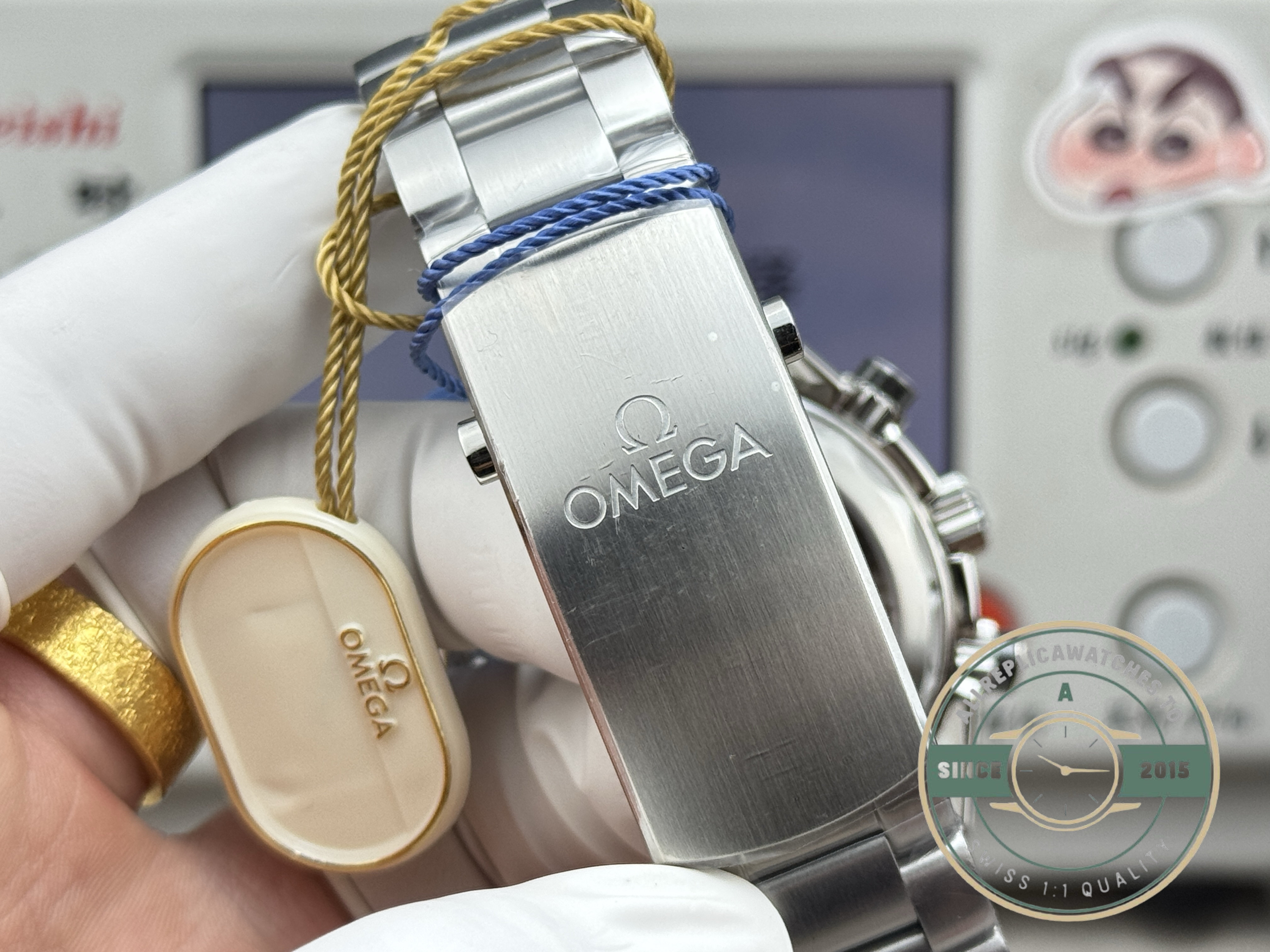 Matte-finished titanium links catching low light, superclone Omega Seamaster Planet Ocean