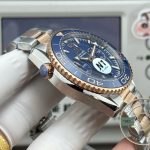 Gold-accented bracelet links on the superclone Omega Planet Ocean 600M chronograph